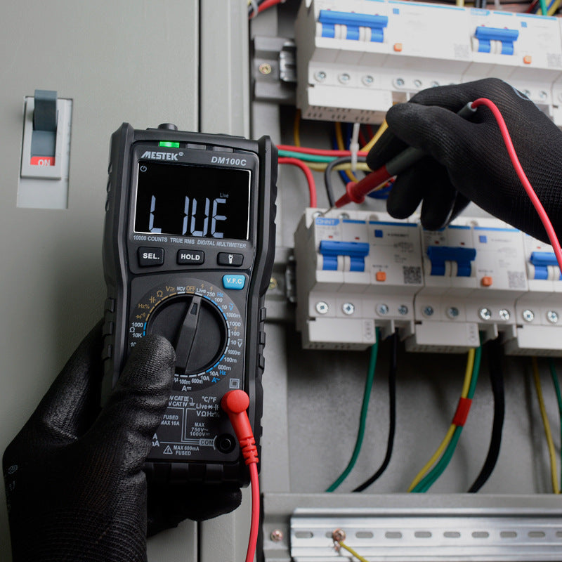 Black handheld Mestek multipurpose professional electrical multimeter used for measuring DC and AC voltage and current.