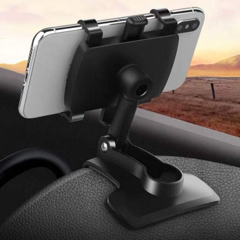 
                  
                    Universal car dashboard phone holder securely gripping a smartphone.
                  
                