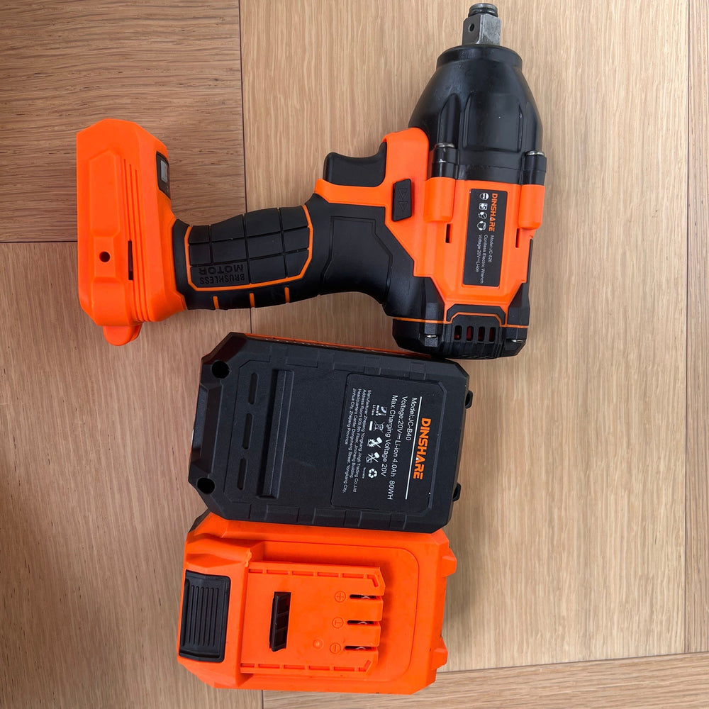 
                  
                    Dinshare 20V Impact Driver with battery on wood surface.
                  
                
