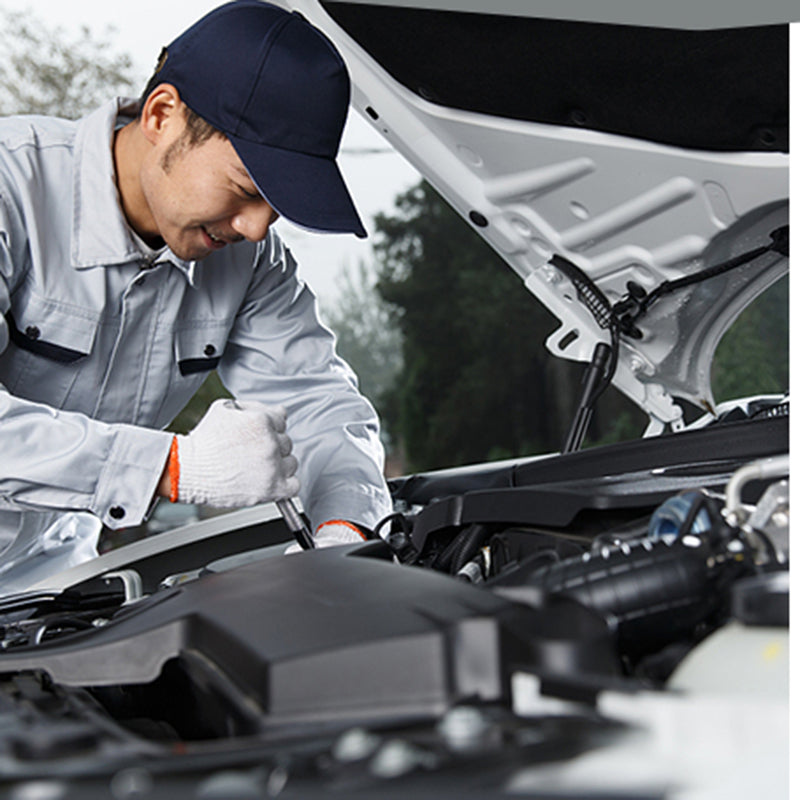 
                  
                    Mechanic using auto repair tool ratchet quick socket wrench under car hood.
                  
                