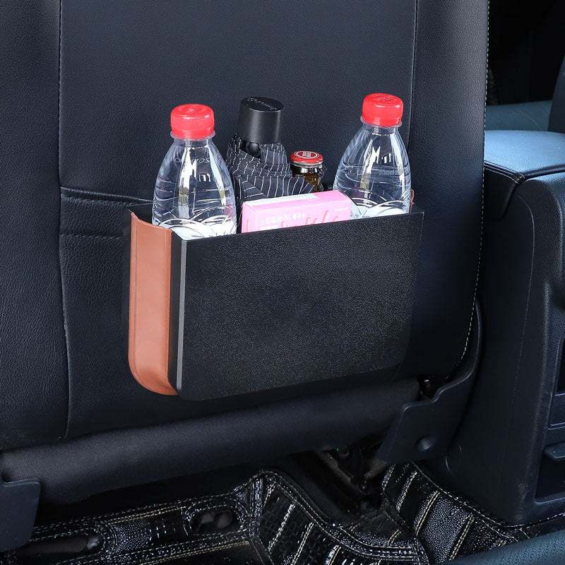 
                  
                    Foldable Seatback Hanging Storage Container in black, holding water bottles, installed on car seat back.
                  
                