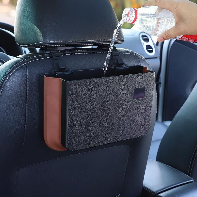 
                  
                    Foldable waterproof hanging storage container attached to car seatback.
                  
                