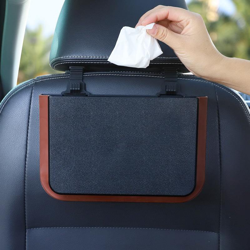 
                  
                    Foldable seatback hanging storage container in classic black attached to car seat.
                  
                