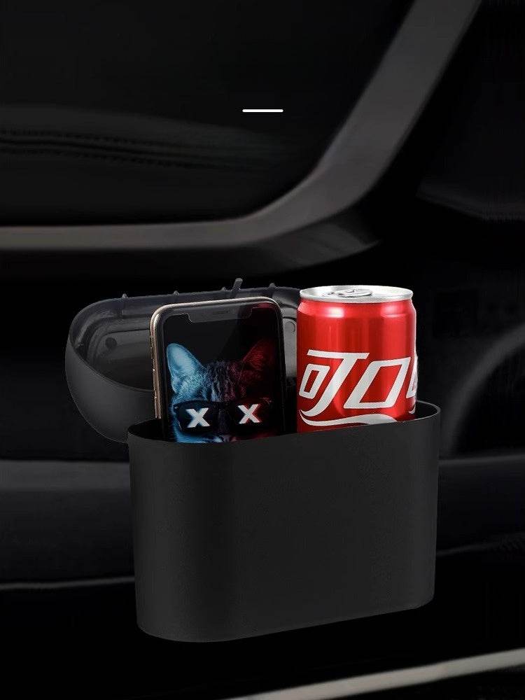 
                  
                    Hanging storage box in car with phone and soda can.
                  
                