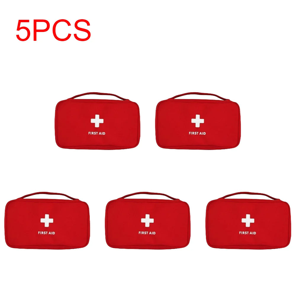 
                  
                    5-piece portable emergency medical first aid kits in red with handles.
                  
                