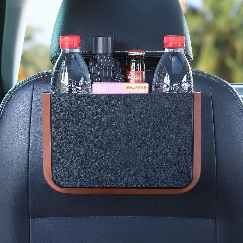
                  
                    Foldable seatback hanging storage container holding bottles and items in a car.
                  
                